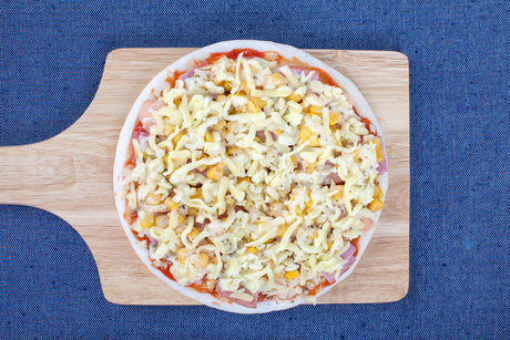 Frozen Pizza on a Chopping Board